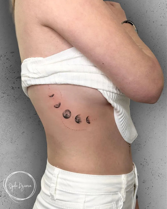 Small Fine Line Moon Phases Tattoo on Women Rib by @soultattoomallorca