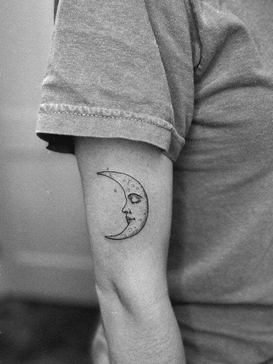 Small Fine Line Moon Tattoo on Women Arm by @blooming.beauty.studio
