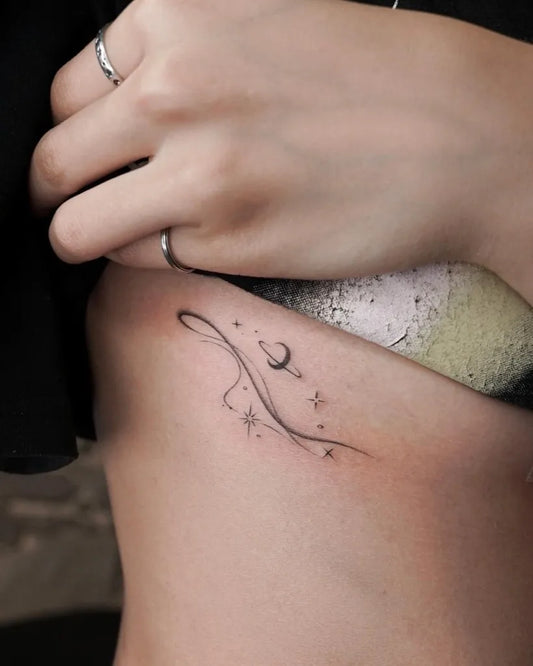 Small Fine Line Moon and Stars Tattoo on Women Rib by @solyn_tattooist