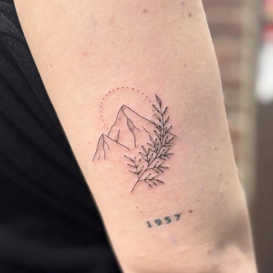 Small Fine Line Mountain and Branch Tattoo on Women Arm by @otqt_dailytatts