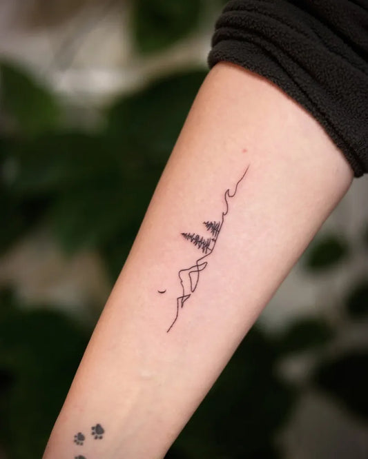 Small Fine Line Mountain and Tree Tattoo on Women Arm by @vvstattoo