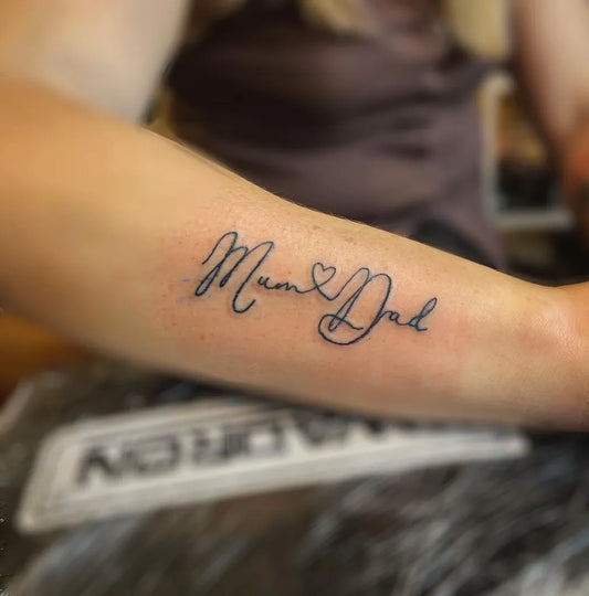 Small Fine Line Mum and Dad Tattoo on Women Arm by @indigo_ink_ni