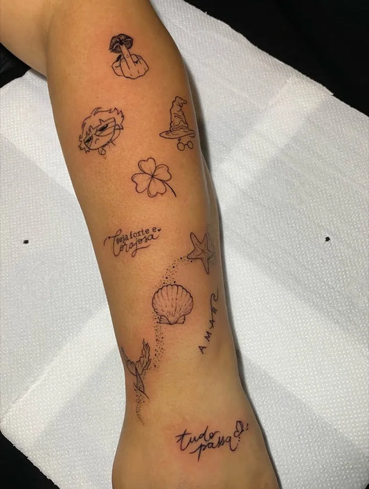 Small Fine Line Mushroom Butterfly Clover Seashell on Women Arm Tattoo by @oka.tattoo