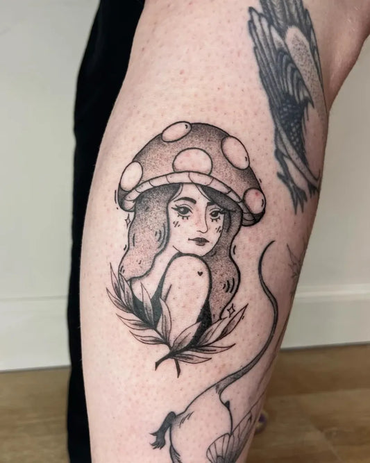 Small Fine Line Mushroom Fairy on Women Thigh Tattoo by @ovenrooster