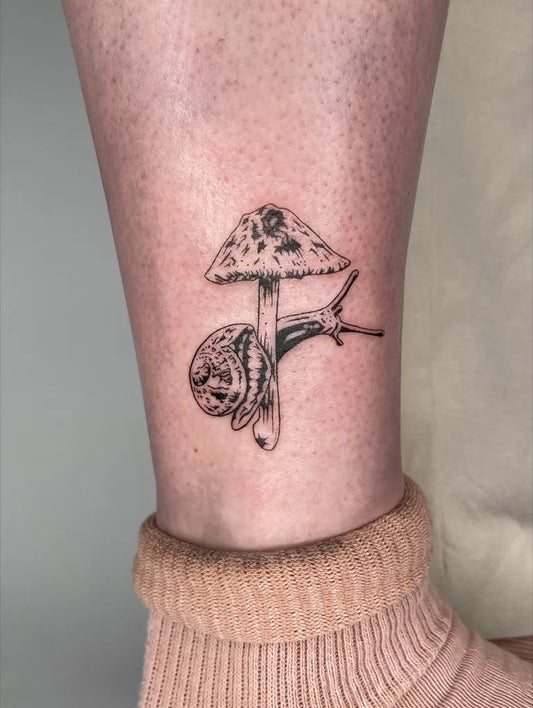 Small Fine Line Mushroom and Snail on Women Ankle Tattoo by @nicol.ink_