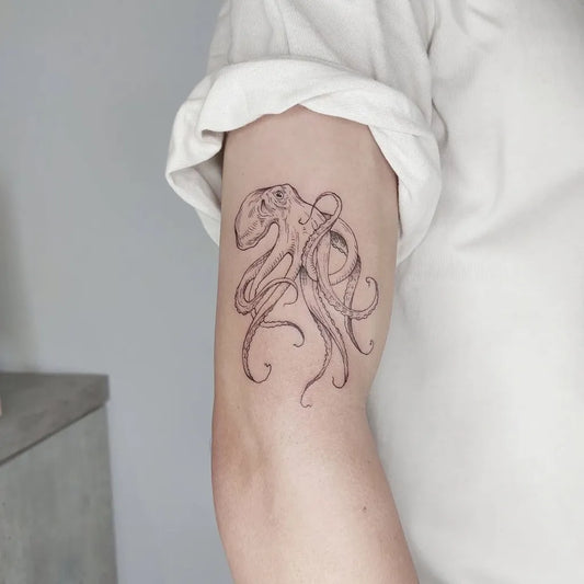 Small Fine Line Octopus Tattoo on Women Arm by @yizutattoo
