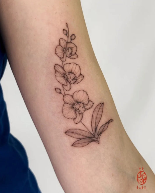 Small Fine Line Orchid Flowers Tattoo on Women Arm by @tt.tats