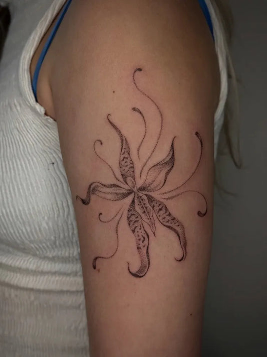 Small Fine Line Orchid Tattoo on Women Shoulder by @nicnpoke