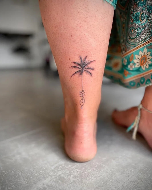 Small Fine Line Palm Tree and Om Symbol Tattoo on Women Ankle by @agathetattoo