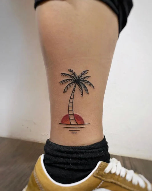 Small Fine Line Palm Tree and Sunset Tattoo on Women Ankle by @naleak_tattoo