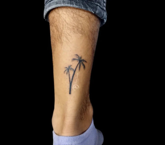 Small Fine Line Palm Trees Tattoo on Men Leg by @taniasantostattoo