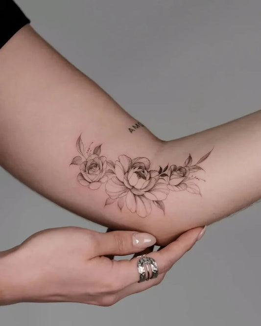 Small Fine Line Peony Flowers on Women Arm Tattoo by @la.source.tattoo