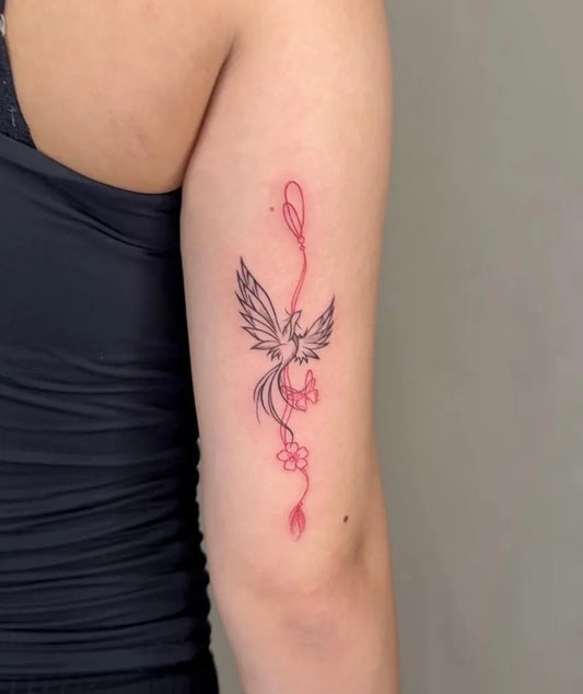 Small Fine Line Phoenix with Trails on Women Arm Tattoo by @inkmealley