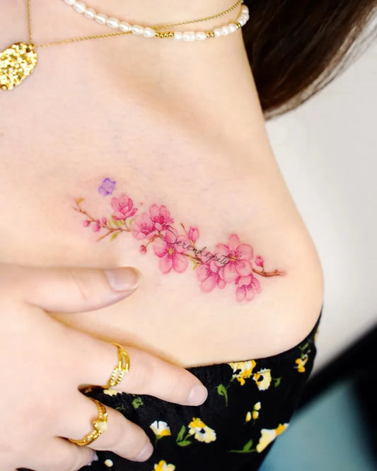 Small Fine Line Pink Cherry Blossom Branch Tattoo on Women Collarbone by @peria_tattoo