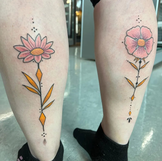 Small Fine Line Pink Daisy Tattoo on Women Calf by @louddoodle