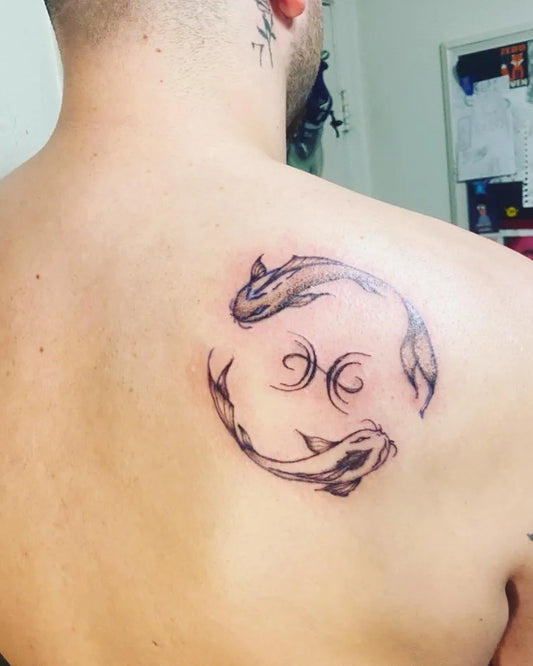 Small Fine Line Pisces Fish Tattoo on Men Shoulder by @mellowday.tattoos