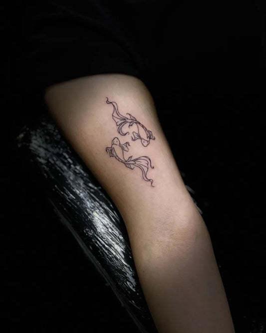 Small Fine Line Pisces Fish Tattoo on Women Arm by @skullinkmarie