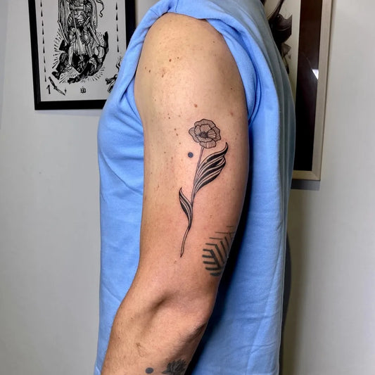 Small Fine Line Poppy Tattoo on Men Arm by @yoo.tattoo