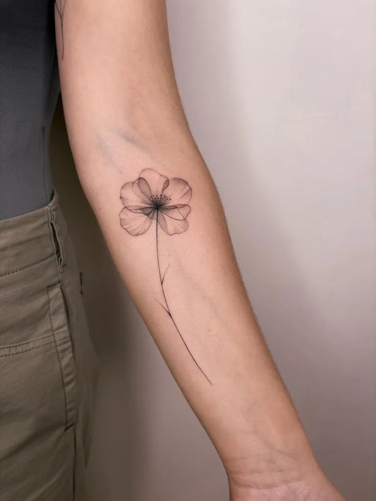 Small Fine Line Poppy Tattoo on Women Arm by @valeries.tattoo
