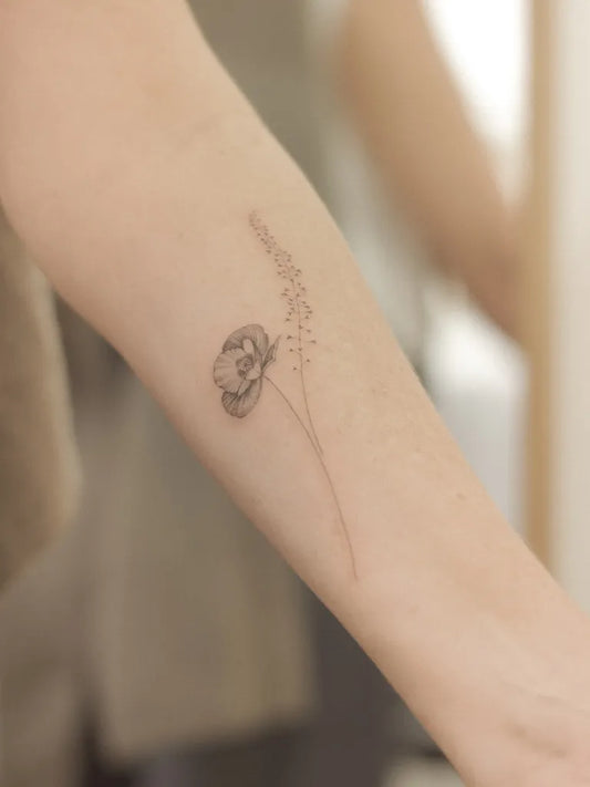 Small Fine Line Poppy and Grass Tattoo on Women Arm by @natalie.vadelma