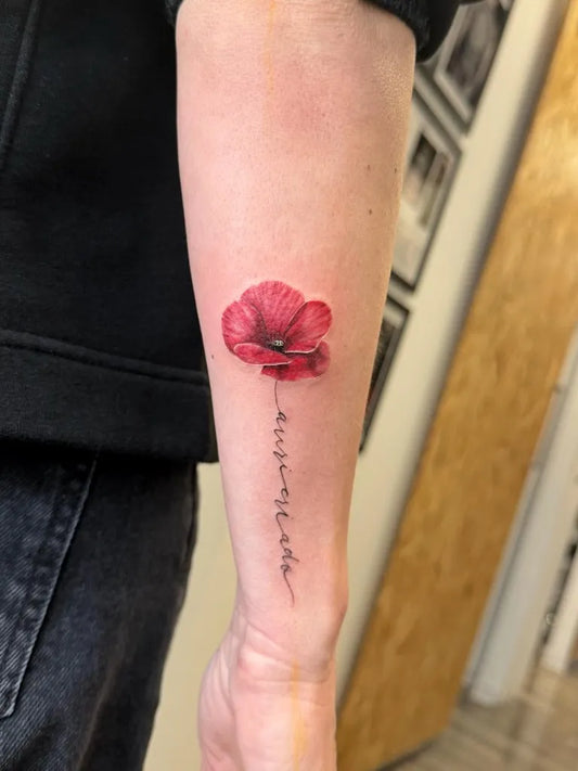 Small Fine Line Poppy and Script Tattoo on Women Arm by @paolo_santilli_tattooer