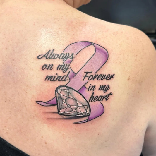 Small Fine Line Purple Ribbon Diamond on Women Shoulder Tattoo by @elevenmainstreet