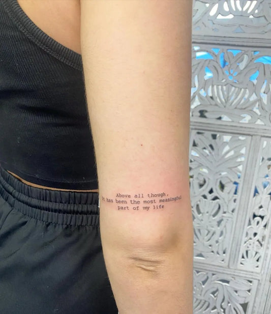 Small Fine Line Quote Tattoo on Women Arm by @mkirkuptattoo