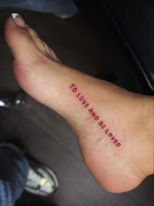 Small Fine Line Quote Tattoo on Women Foot by @dose.of.artistry