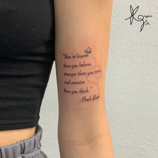 Small Fine Line Quote with Butterfly Tattoo on Women Bicep by @atticustattoo