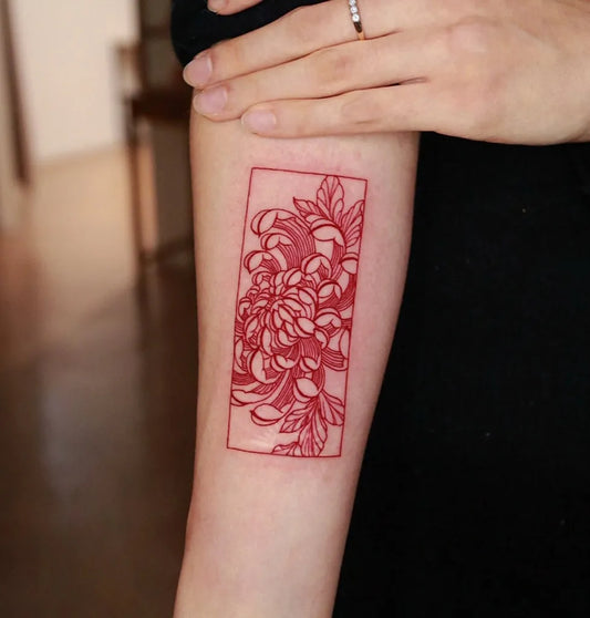 Small Fine Line Red Chrysanthemum Tattoo on Women Arm by @rahon_tatt