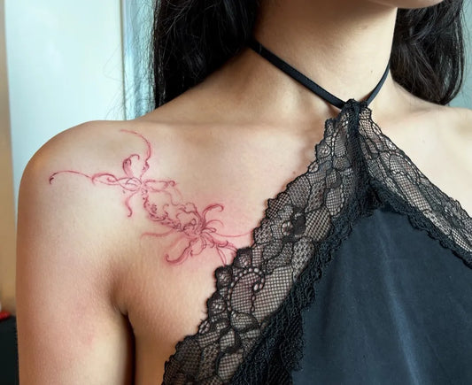 Small Fine Line Red Spider Lily Tattoo on Women Shoulder by @mavs_____