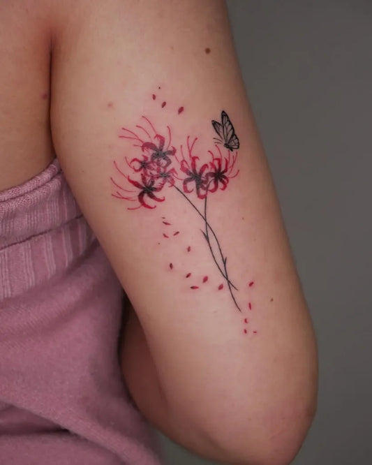 Small Fine Line Red Spider Lily and Butterfly Tattoo on Women Arm by @angiek.tattoo