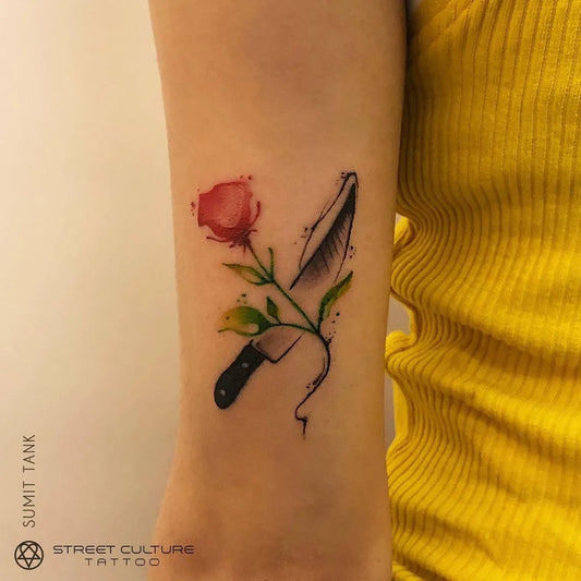 Small Fine Line Rose Knife Tattoo on Women Arm by @streetculturetattoo_official