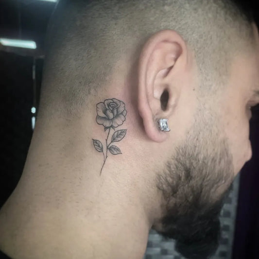 Small Fine Line Rose Tattoo on Men Behind the Ear by @vividinkhagleyrd