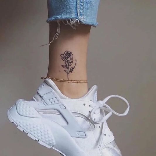 Small Fine Line Rose Tattoo on Women Ankle by @tinytattooinc