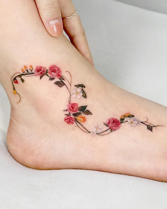 Small Fine Line Rose Vine Tattoo on Women Ankle by @suryeon.tattoo