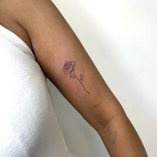 Small Fine Line Rose on Women Arm Tattoo by @dr.inkkk