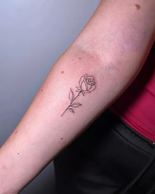 Small Fine Line Rose on Women Arm Tattoo by @seto.tattoo
