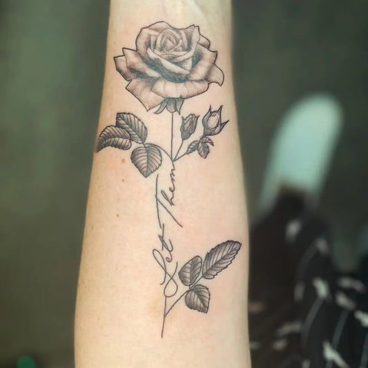 Small Fine Line Rose with Let Them on Women Wrist Tattoo by @pumpkinqueencreations