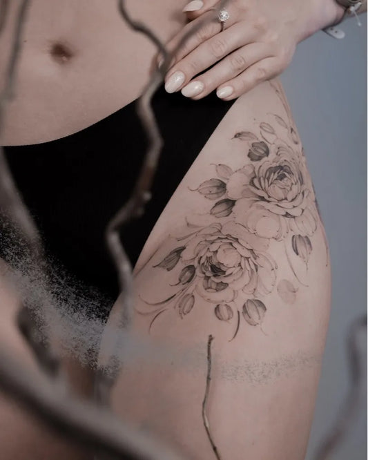 Small Fine Line Roses and Leaves on Women Thigh Tattoo by @anastasiahelfer
