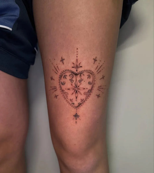 Small Fine Line Sacred Heart Tattoo on Women Thigh by @digitalcarty