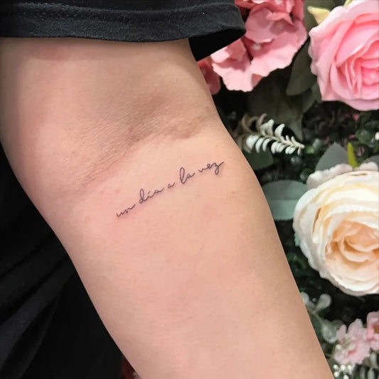 Small Fine Line Script Quote Tattoo on Women Forearm by @thebeautyplugla