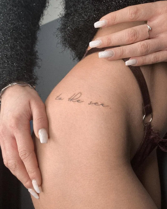 Small Fine Line Script Quote Tattoo on Women Hip by @gayagatto