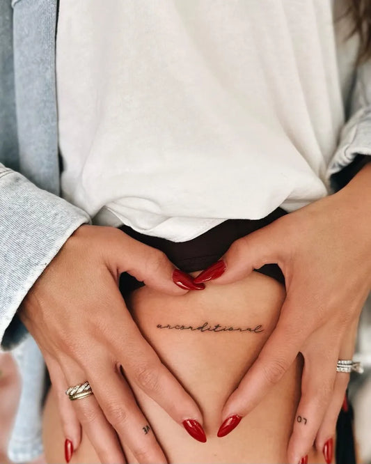 Small Fine Line Script Word Tattoo on Women Hip by @roseinkofficial