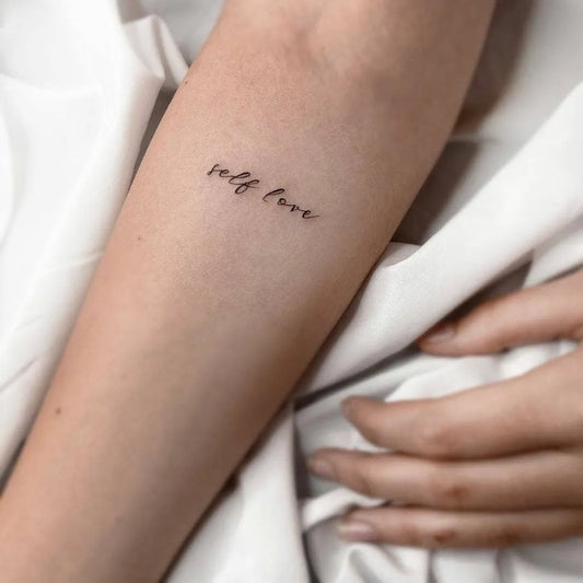 Small Fine Line Self Love Quote Tattoo on Women Arm by @little.tattoos