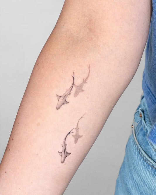 Small Fine Line Sharks on Women Arm Tattoo by @finelinetattoosbali