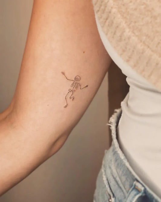 Small Fine Line Skeleton Tattoo on Women Arm by @tattoovasquez