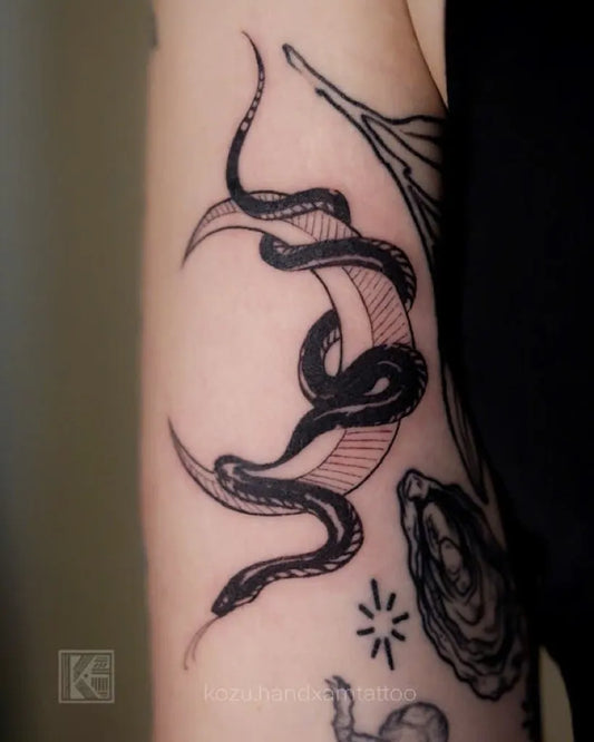 Small Fine Line Snakes and Moon on Women Arm Tattoo by @kozu.handxamtattoo