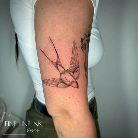 Small Fine Line Sparrow Tattoo on Women Arm by @finelineinkpensacola