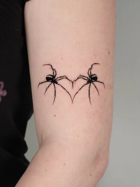 Small Fine Line Spider Heart on Women Arm Tattoo by @eian.tatt